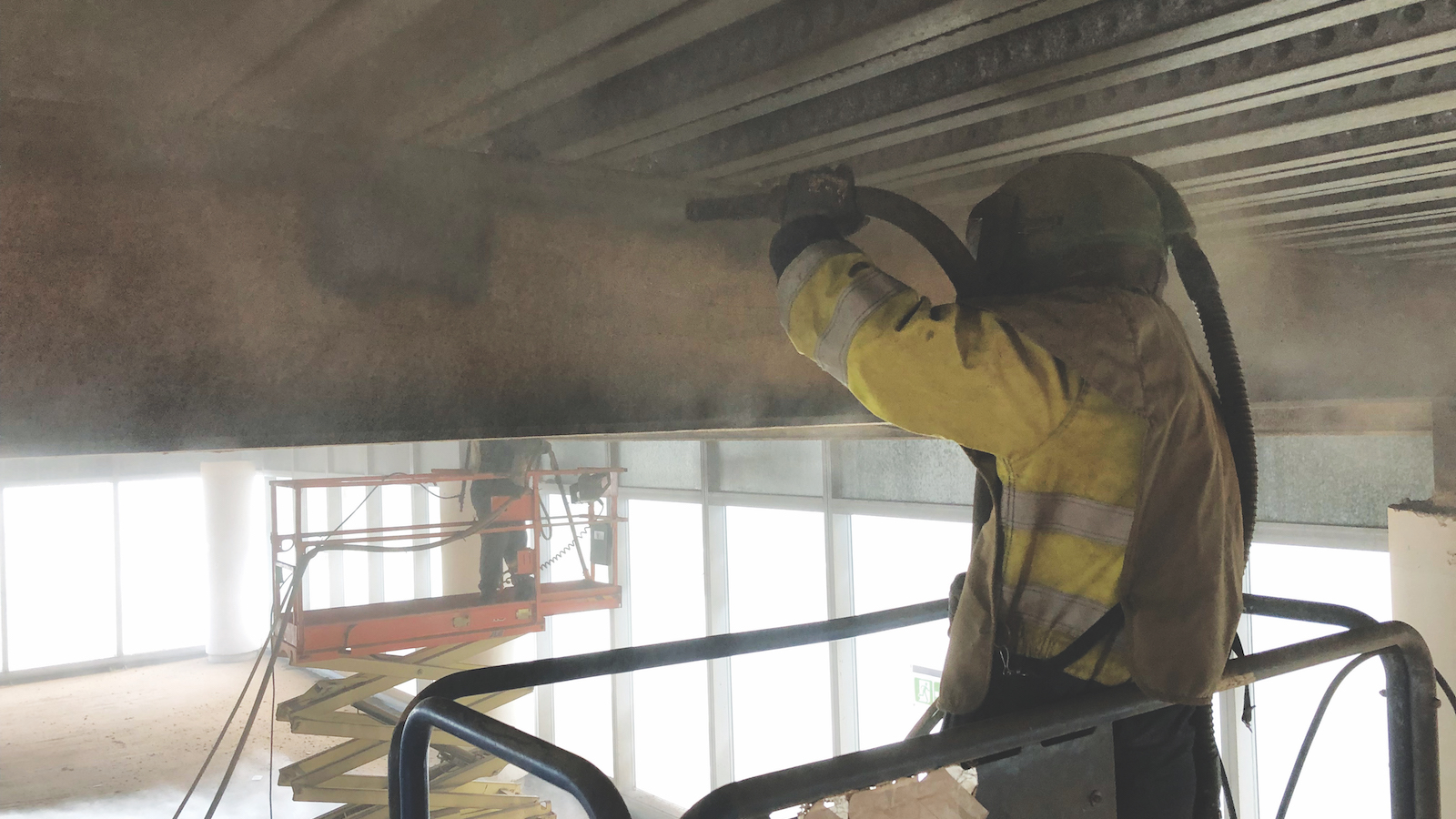 A VariBlast operative works on the internal structural steelwork