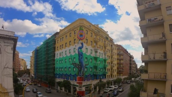 Hunting Pollution in Rome, by Lena Cruz, is Europe’s largest green mural, painted with Airlite paint