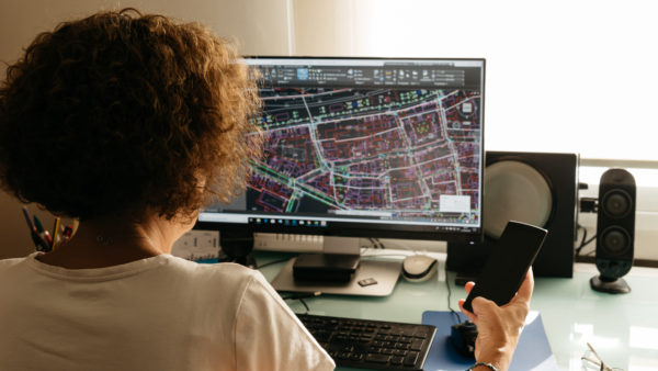 Woman architect drawing with CAD software. Image: Dreamstime