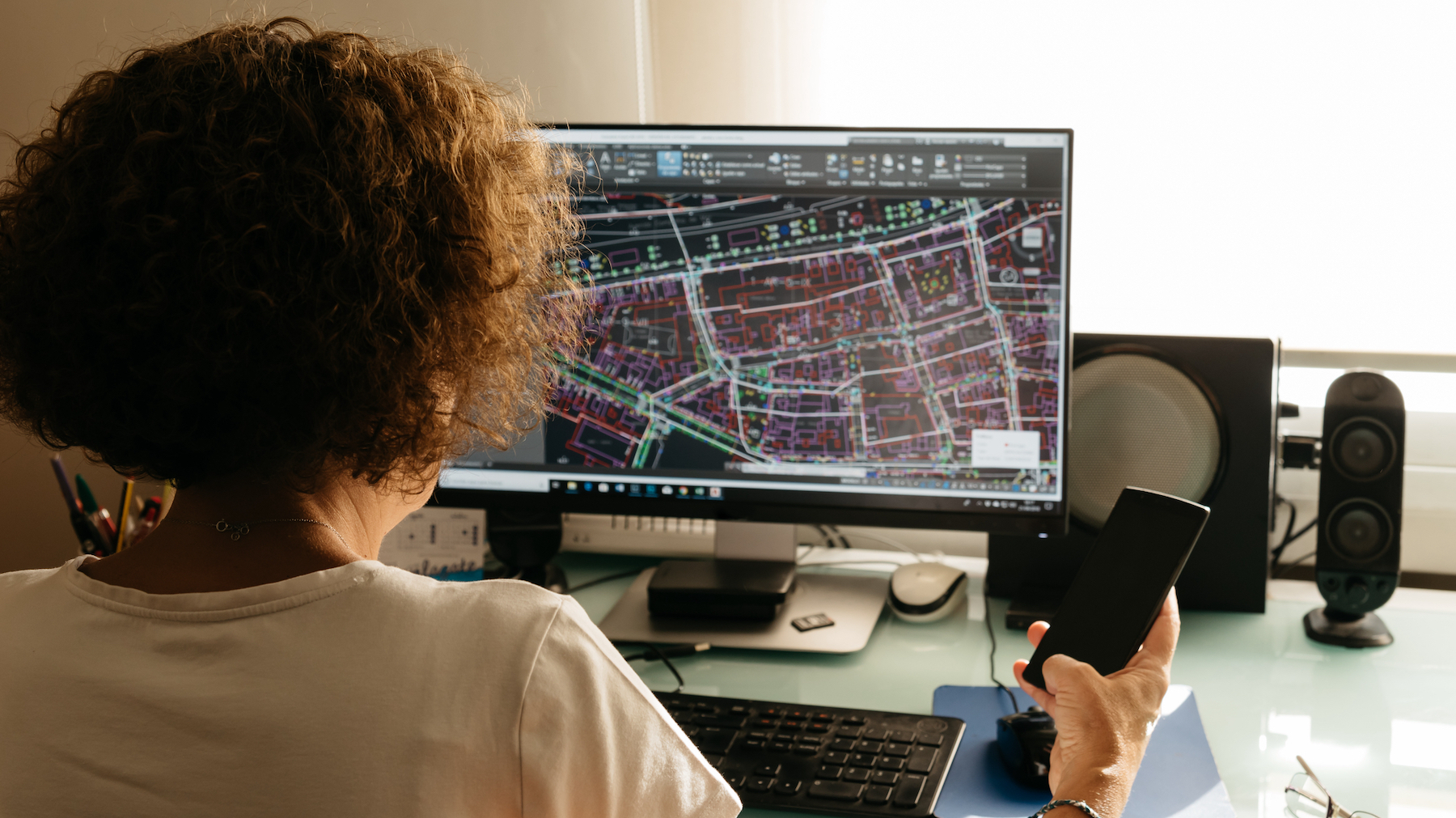 Woman architect drawing with CAD software. Image: Dreamstime