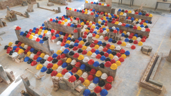 454 hard hats laid out at the Leeds College of Building to represent the number of construction workers who commit suicide every year. April 30 2021.