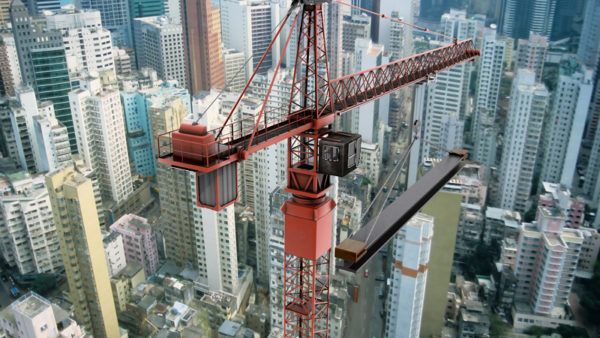 Construction crane from above looking down on skyscrapers
