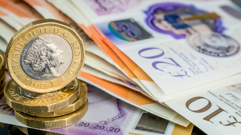 UK money - pound coins and bank notes