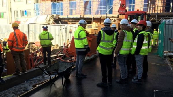 DEC teacher Simon Forestiero and his students from Highlands College tour the C Le Masurier Ltd “Merchant Square” site in St.Helier