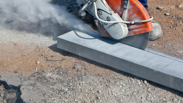 Angle grinding machine and construction dust (Photo 22450054 © Bambulla | Dreamstime.com)