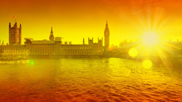 The river Thames with the houses of Parliament in silhouette in the background at sunset on a hot day (Image: Dreamstime)