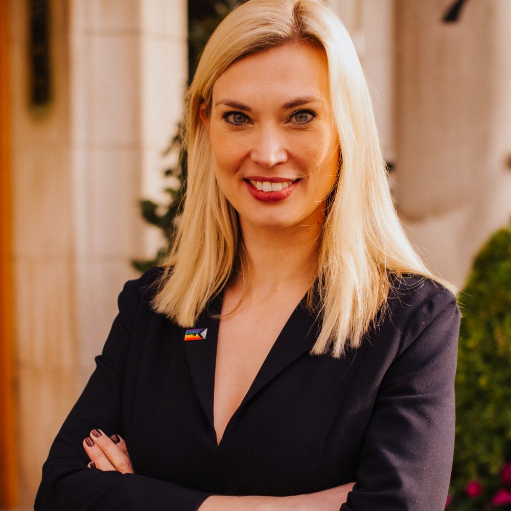 Profile shot of Helen Redfern with arms crossed - smiling