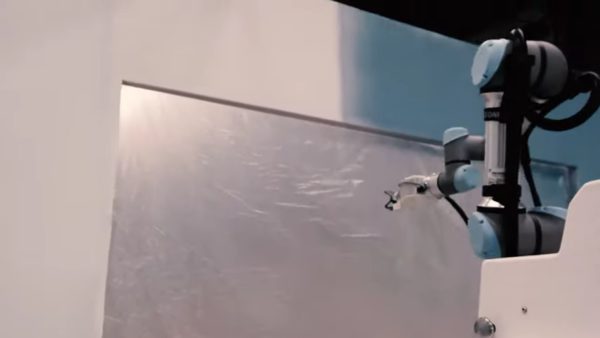 The PACO painting robot applies paint to a wall, avoiding a window (Image courtesy of AkzoNobel/Les Companions)