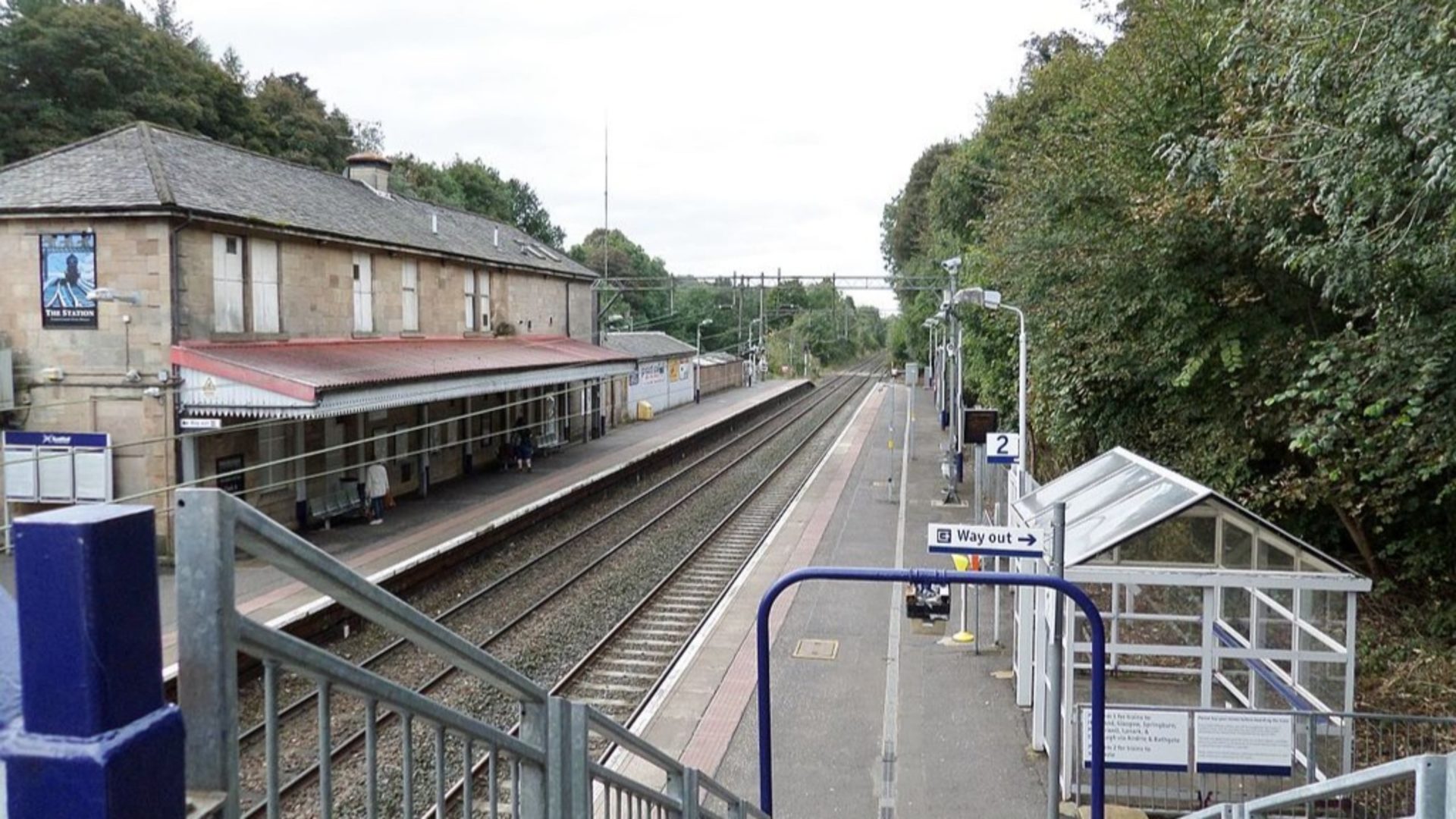 Fatal fall - A train station in the open with track rails.