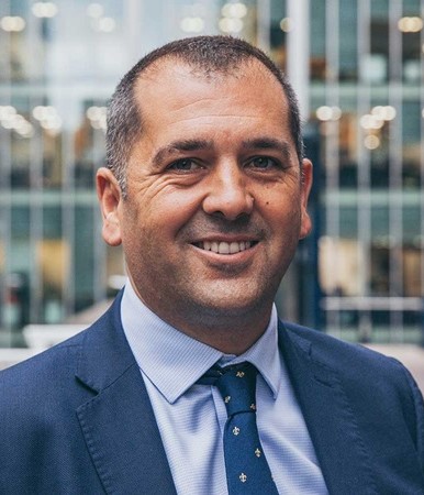 A man smiling at the camera