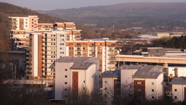 building safety legislation View of a few block of flats and mountains in the background.