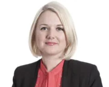 A mugshot of a woman looking at the camera.