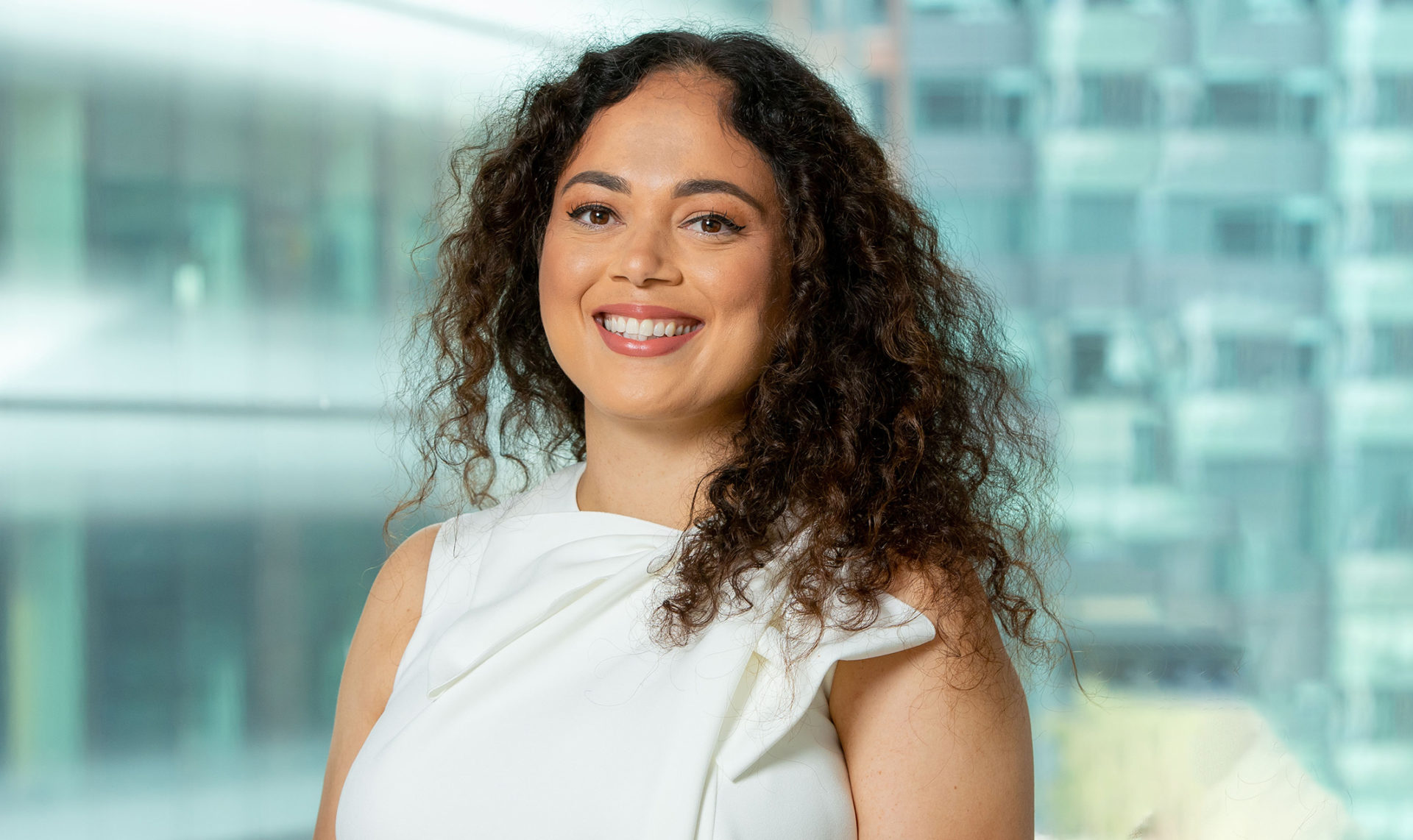 Heashot of a woman smiling at the camera