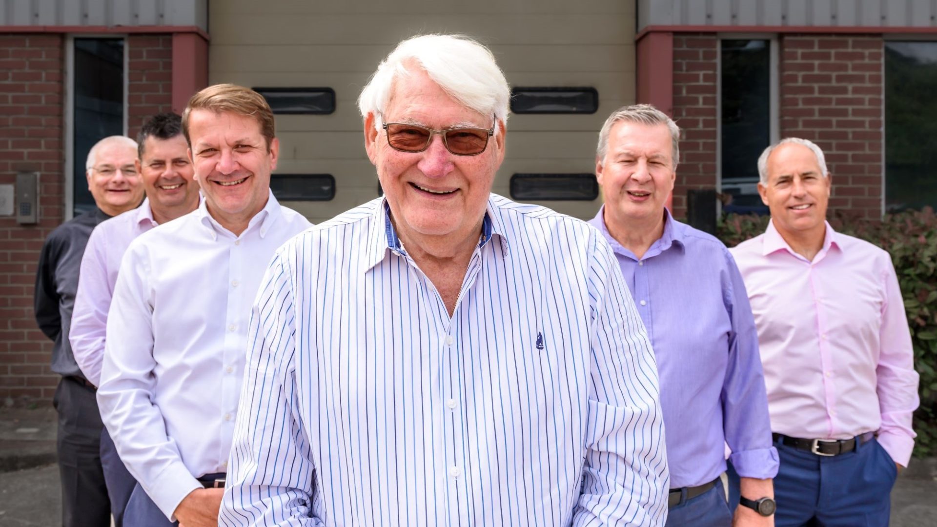 Tony Winch (centre) with the Chisholm & Winch management team.
