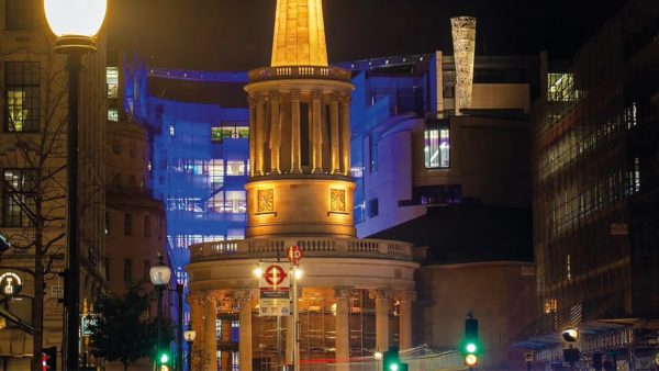 View of a church in a city at night.