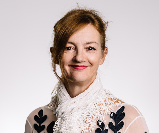 Mugshot of a woman smiling at the camera.