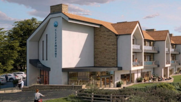 A computer generated imagery of a hotel in the countryside.