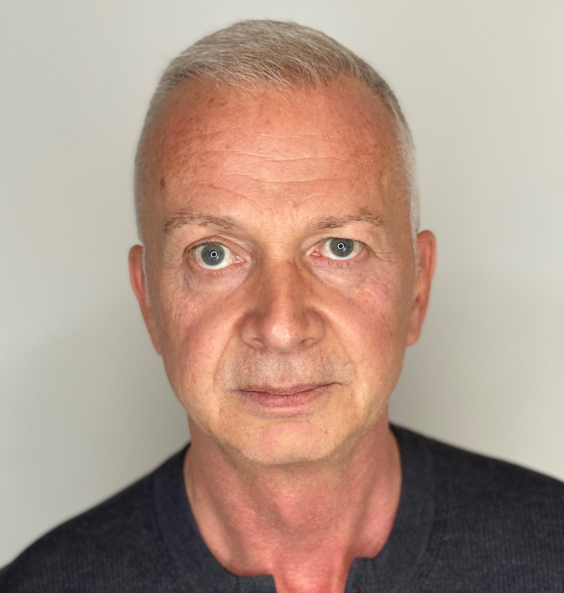 Mugshot of a man looking at the camera