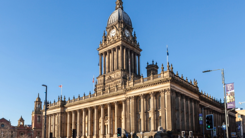 Leeds decarbonisation - View of a big old buildings against a blue sky background.