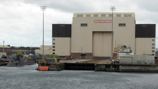 A bit industrial complex next to a river.