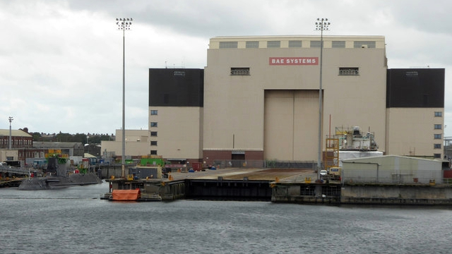 A bit industrial complex next to a river.