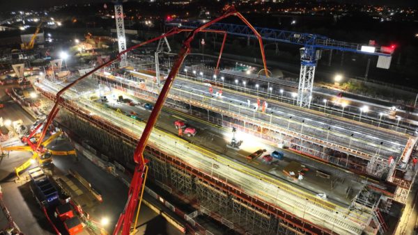 Concrete being poured on a construction site.