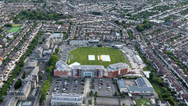 Aerial view of a cricket club surrounded by houses.