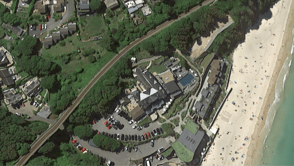 Birdview of a big complex by the beach.