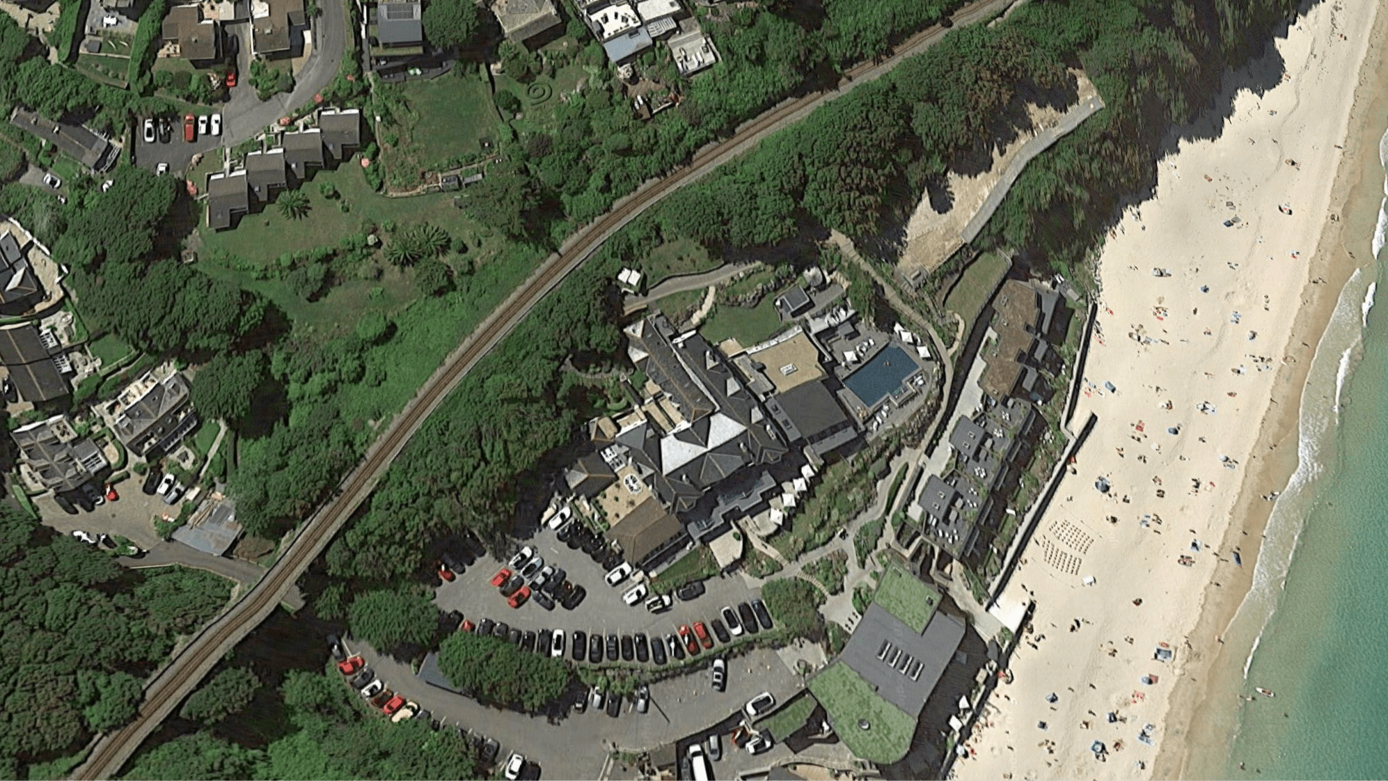 Birdview of a big complex by the beach.