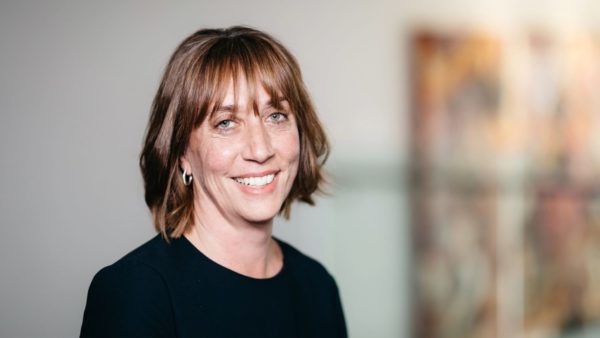 Mugshot of a woman smiling at the camera.