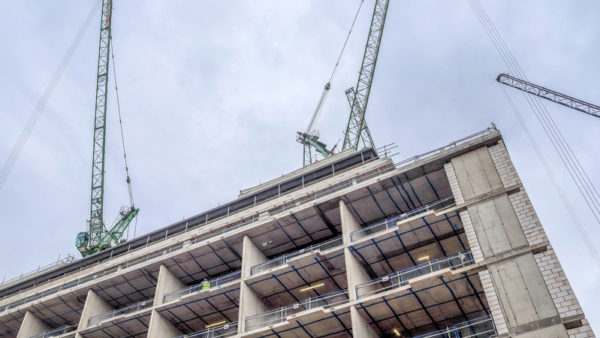 Several cranes on a construction site