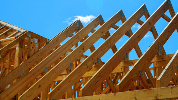 (Image: Photovs via Dreamstime.com) Timber roof of a new home being built.