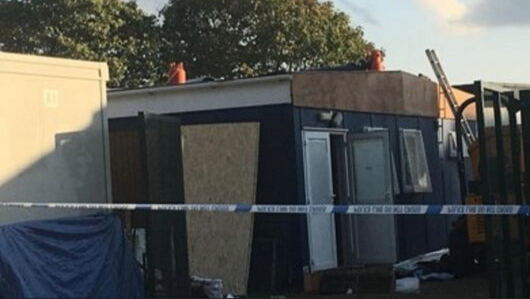 A construction site with a police cordon tape.