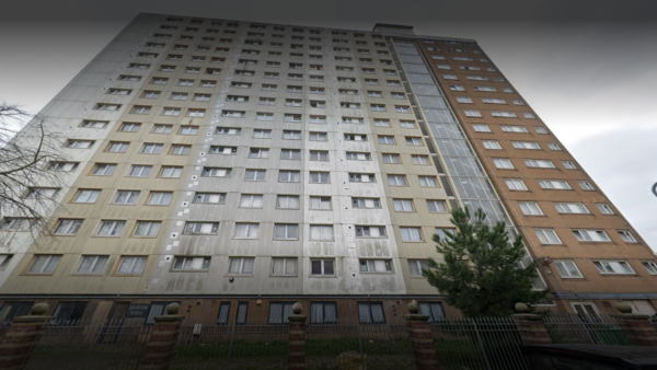 View from the ground of a tall block of flats.