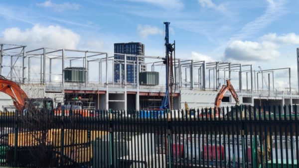 A construction site behind a gate