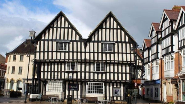 Front of an old Tudor-looking building.
