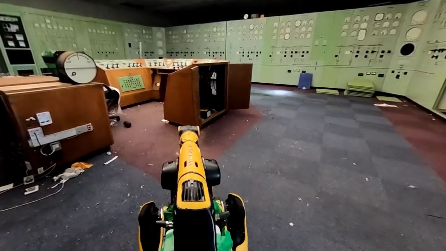 A POV shot from a robot, scanning a nuclear power plant control room