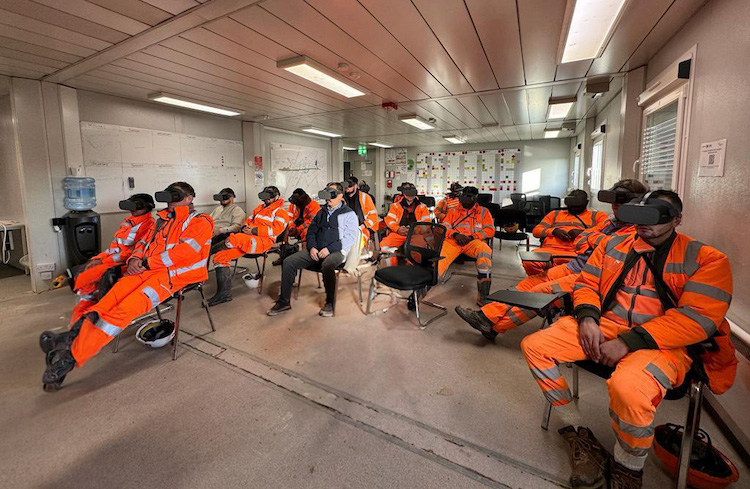 Photo of L Lynch staff being using VR headsets for Best Application of Technology shortlist