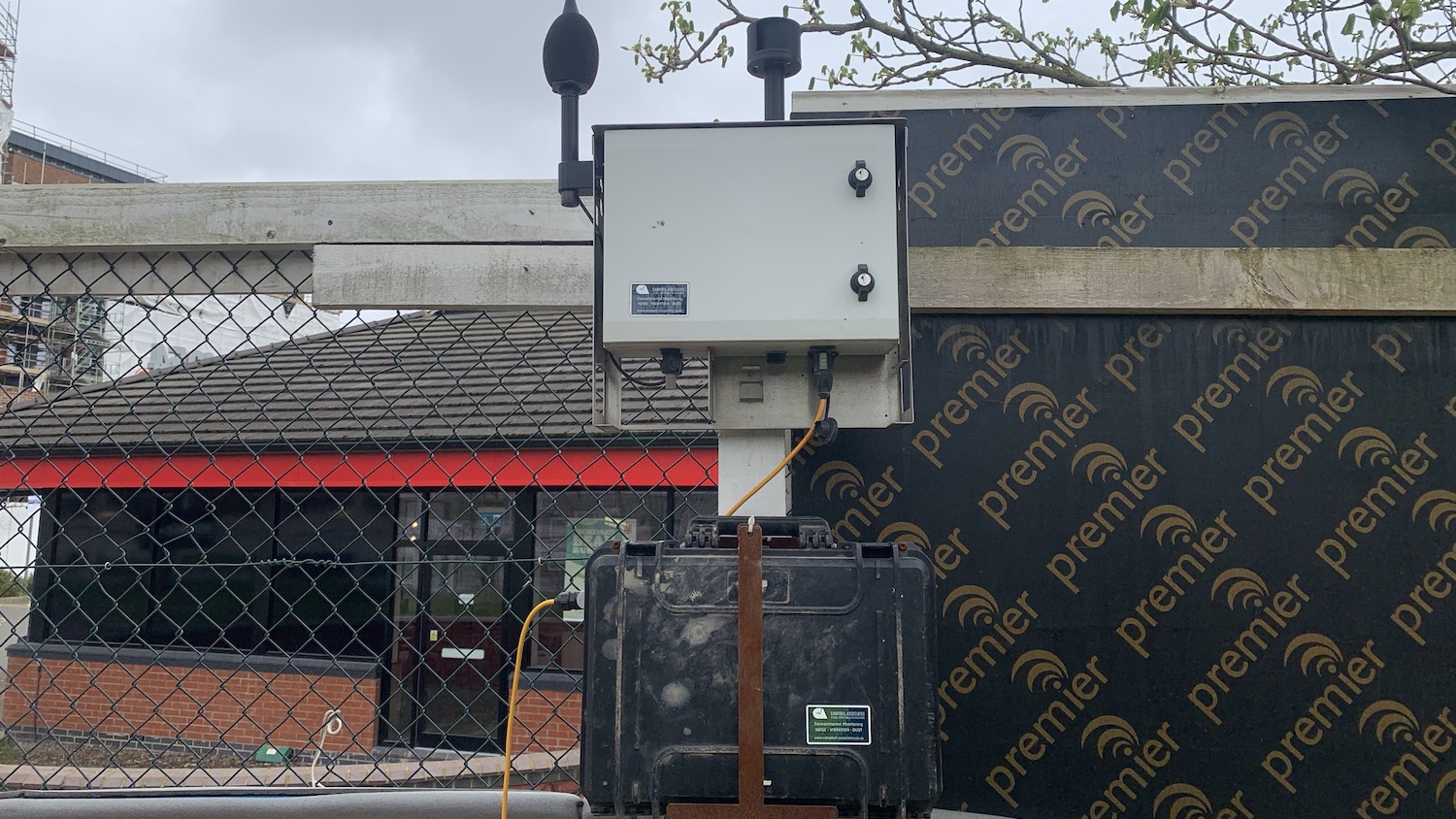 A photo of the AI-enabled combined noise and dust monitor being used by Winvic