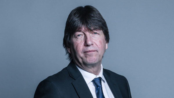 Official mugshot of Gary Porter (Lord Porter of Spalding) wearing a dark suit and a dark blue tie - he said that