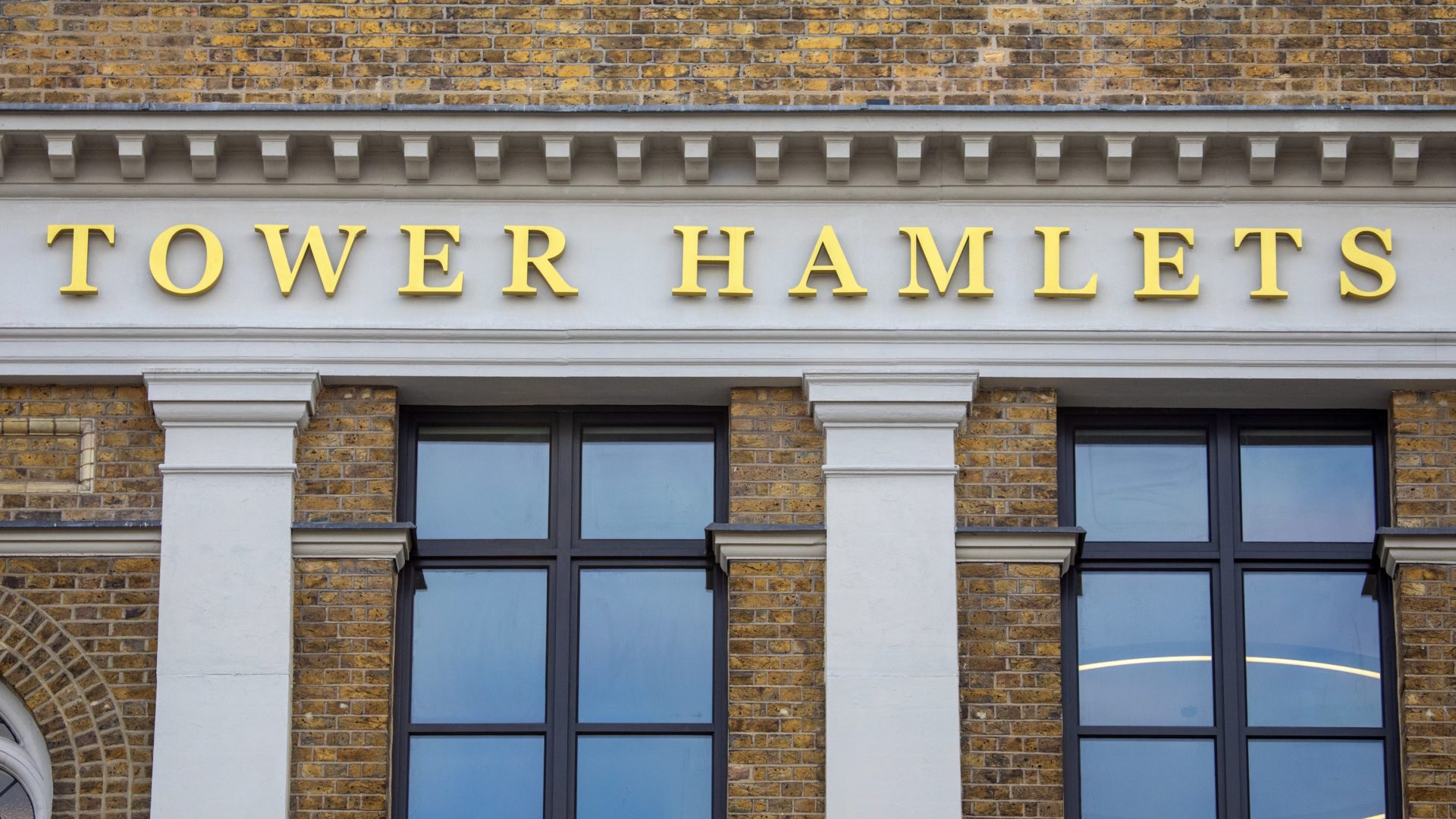 Letters saying 'Tower Hamlets' on the exterior of Tower Hamlets Town Hall in east London. The council has secured its first remediation order against a building owner.