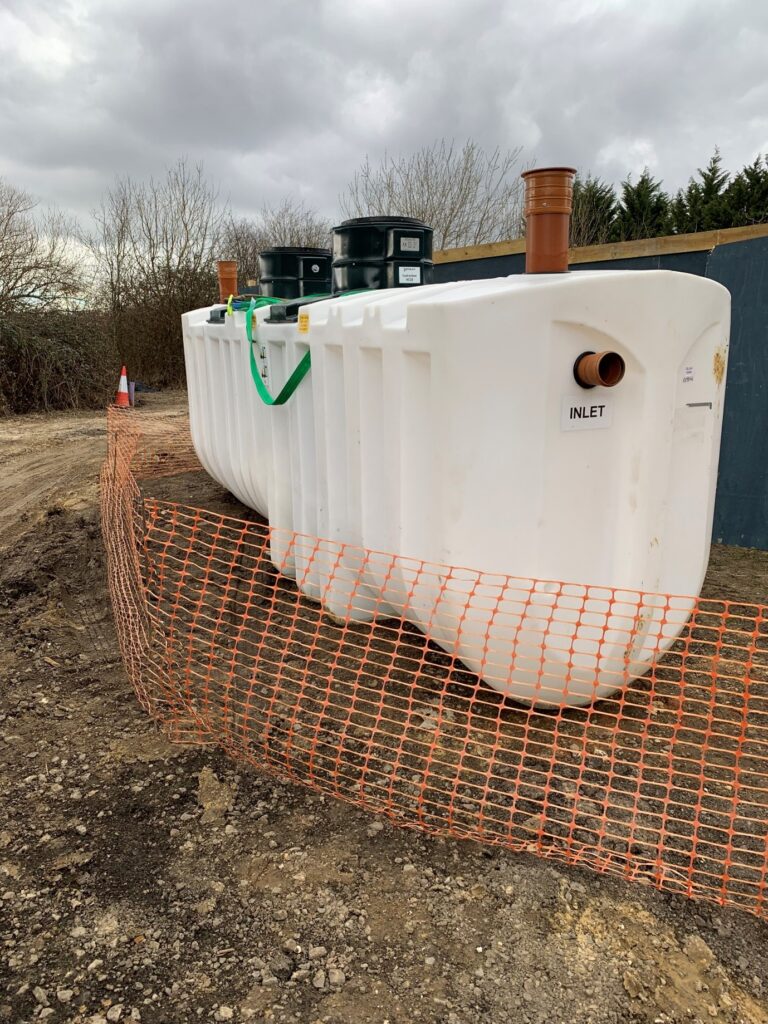 The septic tank that the excavation was being dug to fit into - a company and its director have been fined after a worker suffered multiple bones fractures following an excavation collapse
