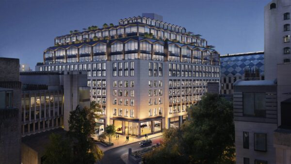 A computer-generated image of a new big office building at night - Mace appointed to deliver one of London’s largest retrofit projects