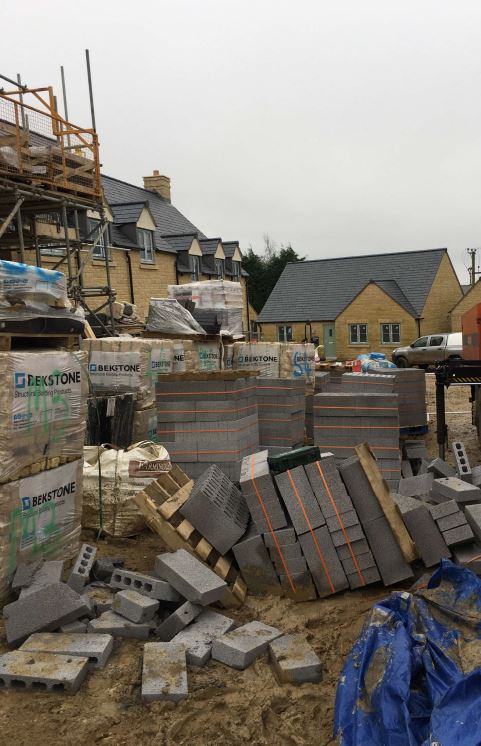 Construction materials in a construction site - Piper Homes has been fined £300,000 after a young worker was crushed to death by concrete blocks.