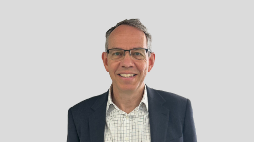 Mugshot of a man with glasses and dark jacket looking at the camera - Wates has hired Robert Stone to lead its public sector team