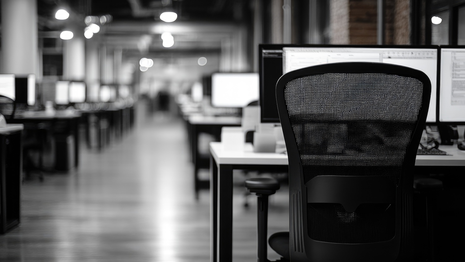 Image of empty desks and unused computers to illustrate digital skills challenge story