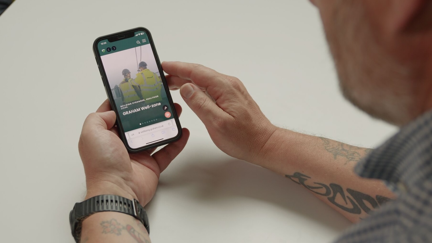 Image of a person using the Well-zone wellbeing app, created by Frog Systems for Graham