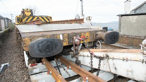 The wagon in contact with the track panel, on the morning after the accident - the rail accidents watchdog has opened an investigation to find what caused the accident.