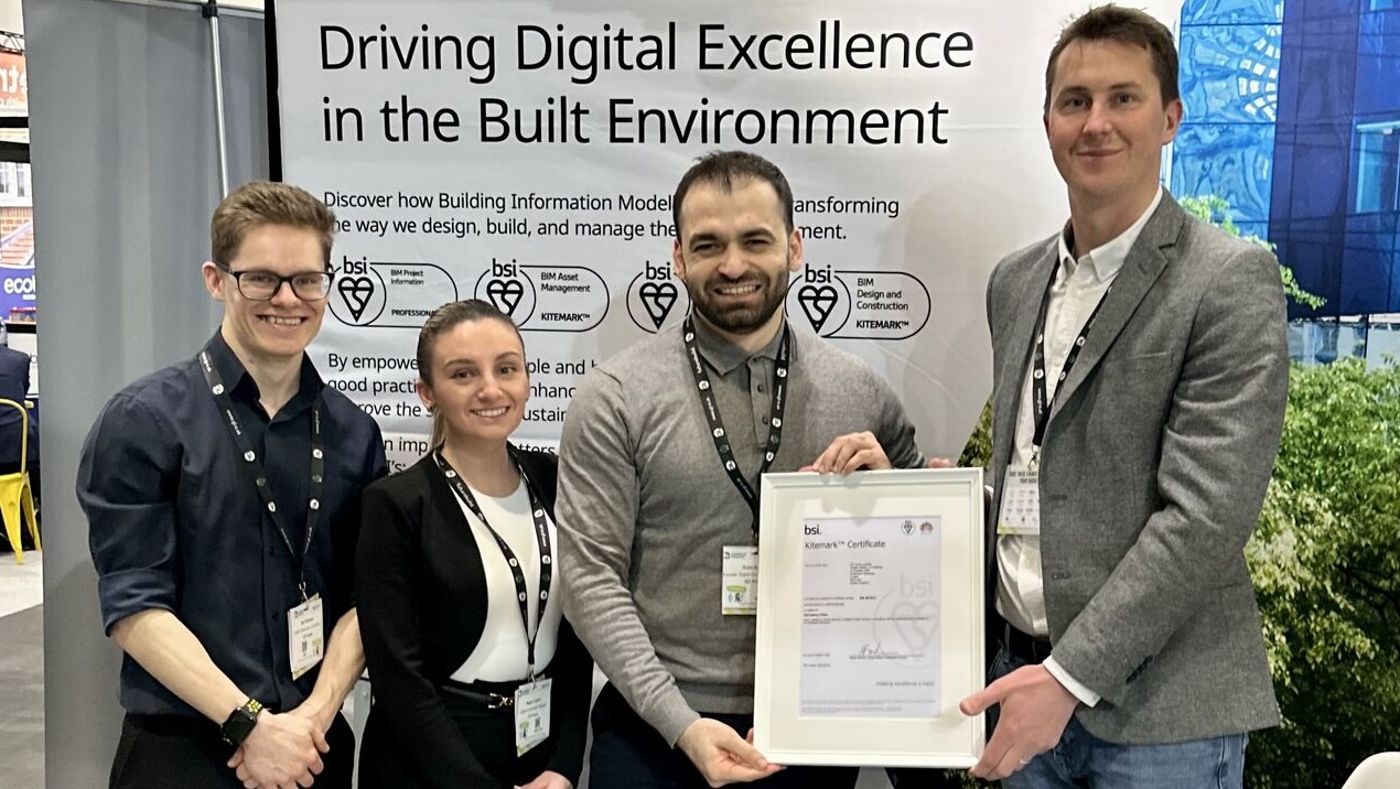 An image of the XD House team receiving their BSI kitemark - for Information Management Best Practice profile