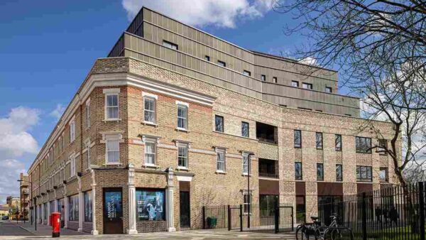 A new development featuring traditional red brick and a moder extension at the top - Durkan has been hit by legacy fire safety remediation issues.